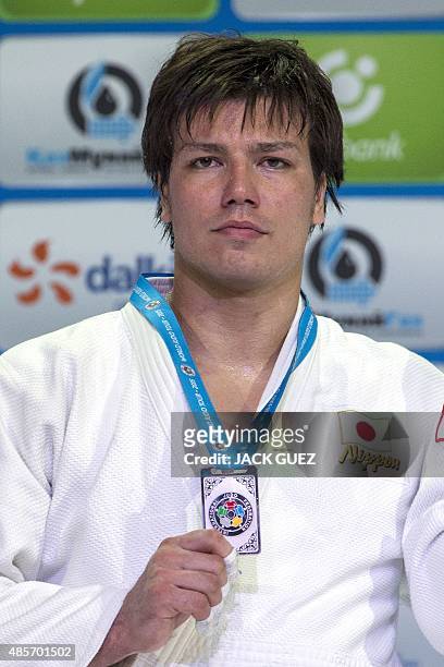 Japans silver medallist Ryu Shichinohe poses with his medal following the mens +100kg category competition at the Judo World Championships in Astana...