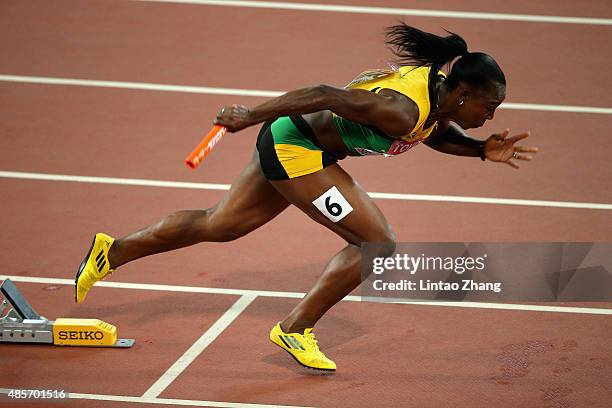 Veronica Campbell-Brown of Jamaica starts in the Women's 4x100 Metres Relay final ahead of Jasmine Todd of the United States during day eight of the...