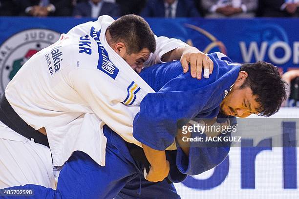 Ukraines Iakiv Khammo competes with South Koreas Kim Sung-Min during the mens bronze medal match, in the +100kg category at the Judo World...