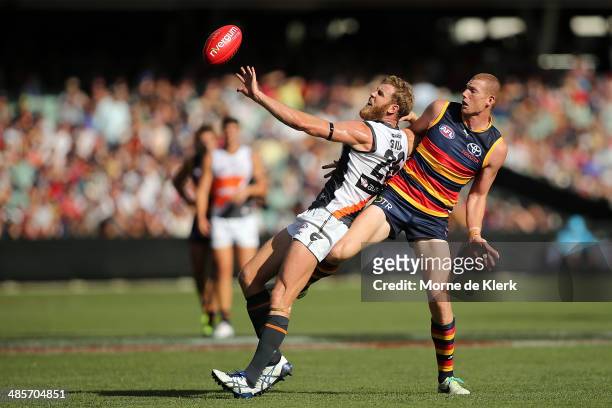 Jonathan Giles of the Giants competes in the ruck with Sam Jacobs of the Crows during the round five AFL match between the Adelaide Crows and the...