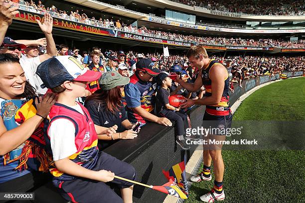 Daniel Talia of the Crows gives a ball to a spectator after the round five AFL match between the Adelaide Crows and the Greater Western Sydney Giants...
