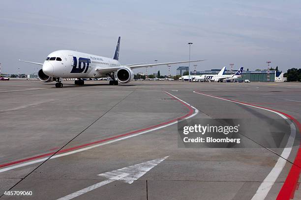 Boeing 787-8 Dreamliner aircraft operated by LOT Polish Airlines SA stands on the tarmac at Warsaw Chopin airport in Warsaw, Poland, on Saturday,...