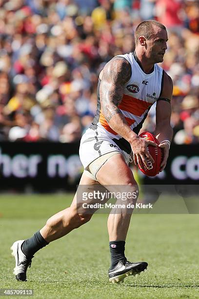 Josh Hunt of the Giants runs with the ball during the round five AFL match between the Adelaide Crows and the Greater Western Sydney Giants at...