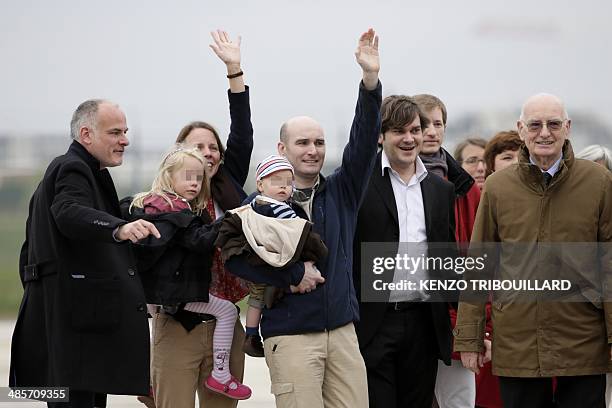 Nicolas Henin is welcomed by his family and relatives upon his arrival with the three other French journalists taken hostage in Syria last year and...