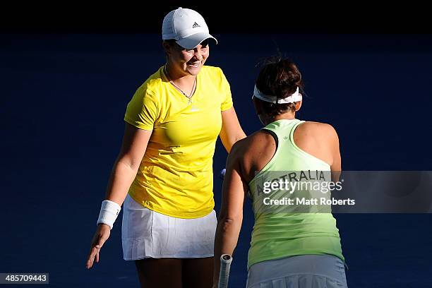 Ashleigh Barty celebrates a point with Casey Dellacqua of Australia in their doubles match against Anna-Lena Groenefeld and Julia Goerges of Germany...