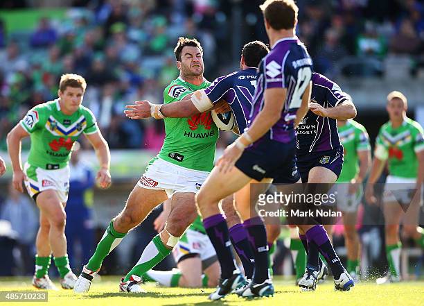 David Shillington of the Raiders is tackled during the round seven NRL match between the Canberra Raiders and the Melbourne Storm at GIO Stadium on...