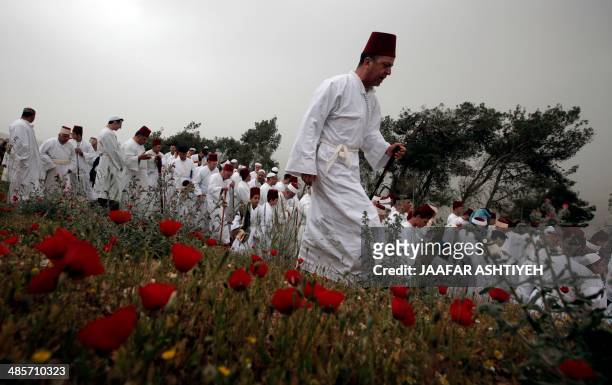Samaritan worshipers take part in a prayer during a Passover ceremony at Mount Gerizim near the northern West Bank city of Nablus on April 20, 2014....