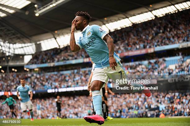 Raheem Sterling of Manchester City celebrates scoring his team's first goal with his team mates during the Barclays Premier League match between...