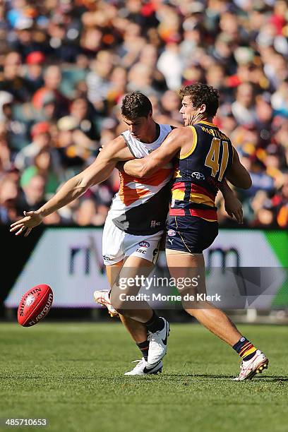 Jonathon Patton of the Giants competes with Kyle Hartigan of the Crows during the round five AFL match between the Adelaide Crows and the Greater...