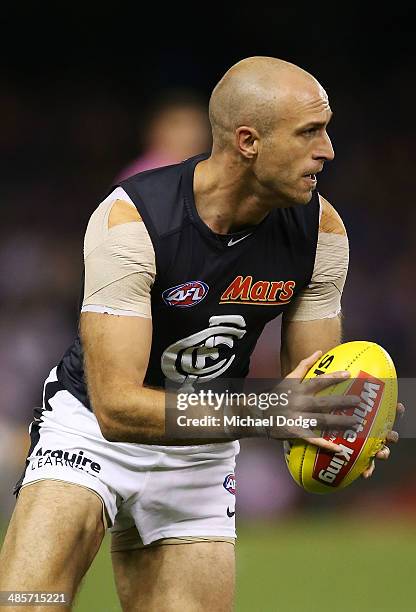 Chris Judd of the Blues looks ahead with the ball during the round five AFL match between the Western Bulldogs and the Carlton Blues at Etihad...