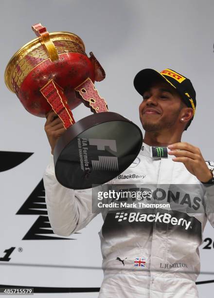 Lewis Hamilton of Great Britain and Mercedes GP celebrates his victory following the Chinese Formula One Grand Prix at the Shanghai International...