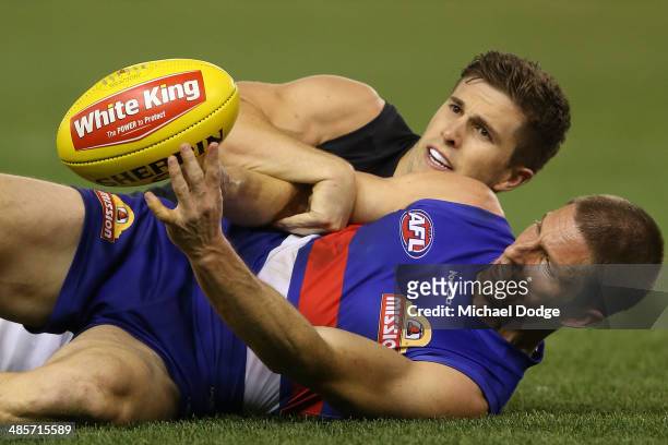 Marc Murphy of the Blues tackles Matthew Boyd of the Bulldogs during the round five AFL match between the Western Bulldogs and the Carlton Blues at...