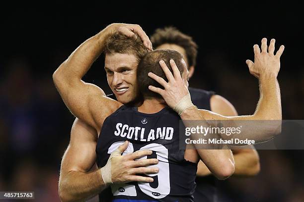 Heath Scotland of the Blues celebrates a goal with Lachie Henderson during the round five AFL match between the Western Bulldogs and the Carlton...