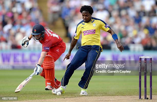 Fidel Edwards of Hampshire tries to beat Karl Brown of Lancashire to the ball during the NatWest T20 Blast Semi Final between Hampshire Hawks and...