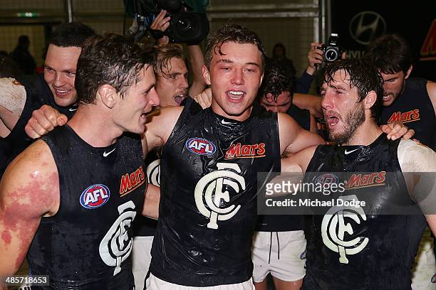 Andrejs Everitt Patrick Cripps and Dale Thomas celebrate their win during the round five AFL match between the Western Bulldogs and the Carlton Blues...