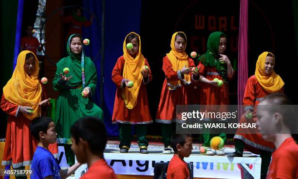 Afghan children of The Mobile Mini Circus for Children perform in Kabul on April 20, 2014. Children from The Mobile Mini Circus for Children...