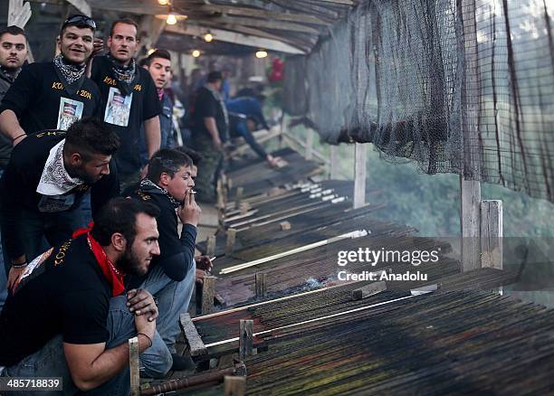 St. Mark's and Panagia Erithiani church congregations ignite thousands of home-made rockets at 'Rocket War' during Greek Orthodox Easter celebrations...