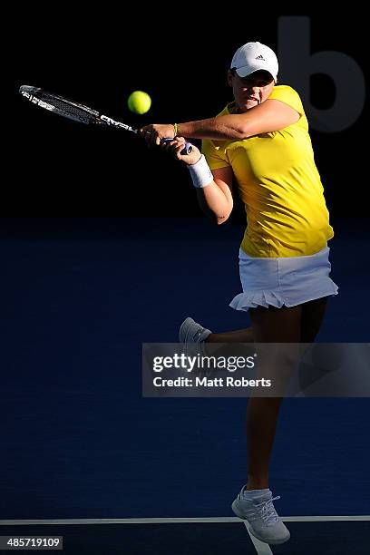 Ashleigh Barty of Australia plays a backhand shot in her doubles match with Casey Dellacqua against Anna-Lena Groenefeld and Julia Goerges of Germany...