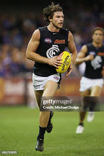 Bryce Gibbs of the Blues runs with the ball during the round five AFL match between the Western Bulldogs and the Carlton Blues at Etihad Stadium on...