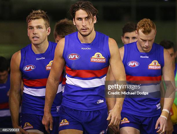 Shaun Higgins and Ryan Griffin of the Bulldogs walk up the race during the round five AFL match between the Western Bulldogs and the Carlton Blues at...