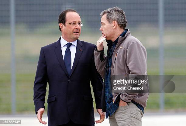 French journalist, Didier Francois is welcomed by Frech President, Francois Hollande upon his arrival at the Villacoublay military airport on April...