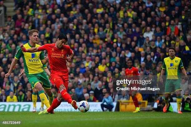 Luis Suarez of Liverpool scores their second goal during the Barclays Premier League match between Norwich City and Liverpool at Carrow Road on April...