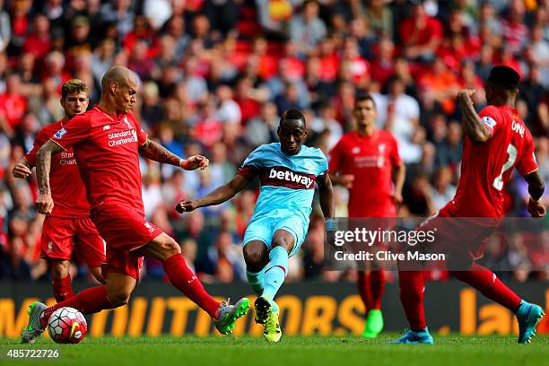 Diafra Sakho of West Ham United scores his team's third goal during the Barclays Premier League match between Liverpool and West Ham United at...