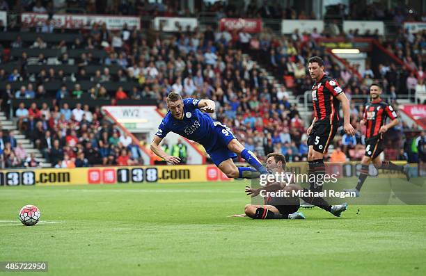 Steve Cook of Bournemouth fouls Jamie Vardy of Leicester City resulting in a penalty during the Barclays Premier League match between A.F.C....