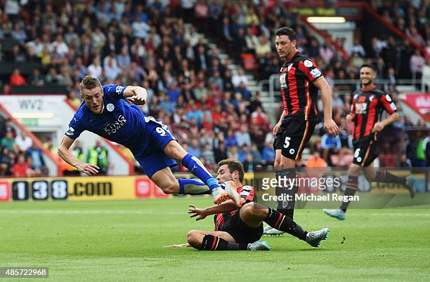 Steve Cook of Bournemouth fouls Jamie Vardy of Leicester City resulting in a penalty during the Barclays Premier League match between A.F.C....
