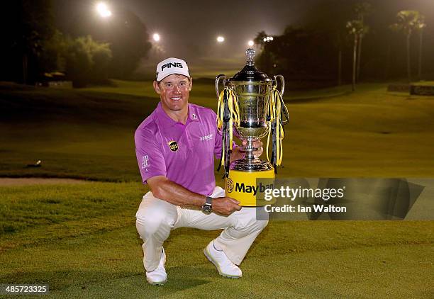 Lee Westwood of England celebrates with the trophy after winning the Final round of the 2014 Maybank Malaysian Open at Kuala Lumpur Golf & Country...