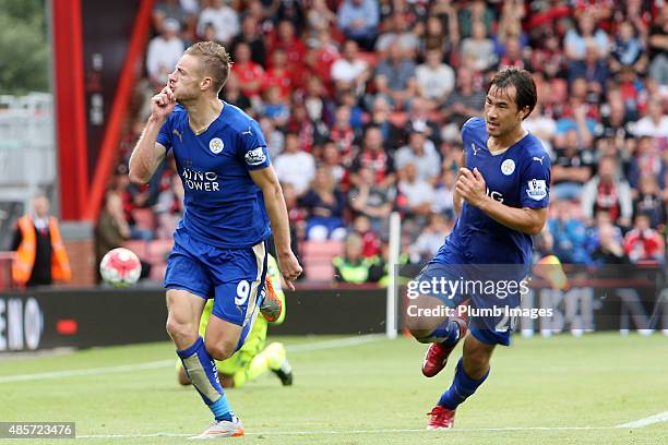 Jamie Vardy of Leicester City celebrates with Shinji Okazaki of Leicester City after scoring from the penalty spot to make it 1-1 during the Premier...