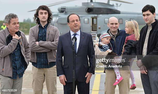 French President Francois Hollande delivers a speech upon released French hostages' arrival at the Villacoublay military airbase on April 20, 2014 in...