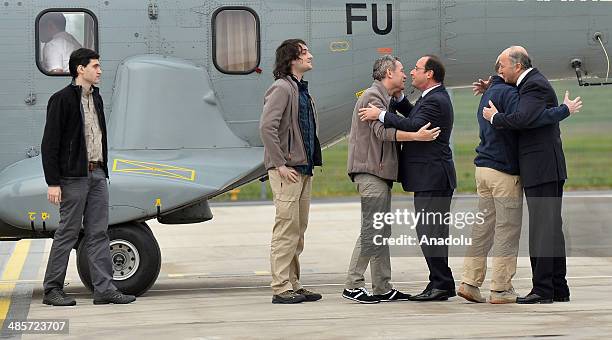 Released French hostages Pierre Torres , Edouard Elias , Didier Francois , Nicolas Henin are welcomed by French President Francois Hollande and...