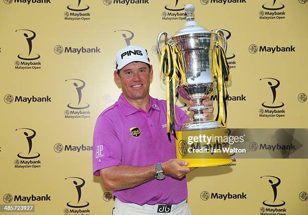 Lee Westwood of England celebrates with the trophy after winning the Final round of the 2014 Maybank Malaysian Open at Kuala Lumpur Golf & Country...