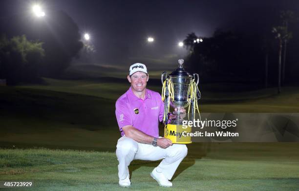 Lee Westwood of England celebrates with the trophy after winning the Final round of the 2014 Maybank Malaysian Open at Kuala Lumpur Golf & Country...