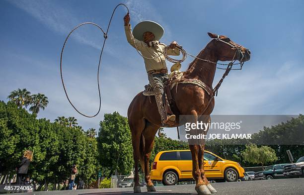 Mexican Vaquero Pedro shows his roping skills in program to celebrate the Easter at the La Placita square in Los Angeles,California, on April 19,...