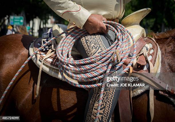 Mexican Vaquero Pedro preparing to demonstrate his roping skills in program to celebrate the Easter at the La Placita square in Los...