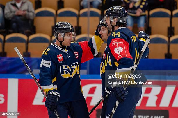 Chris Campoli of HV71 celebrate with Teemu Laine of HV71and Ryan O'Byrne of HV71 after scoring during the Champions Hockey League group stage game...