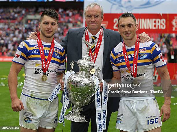 Tom Briscoe, the Leeds Rhino's coach Brian McDermott and Kevin Sinfield of Leeds Rhinos celebrate with the Ladbrokes Challenge Cup trophy after the...