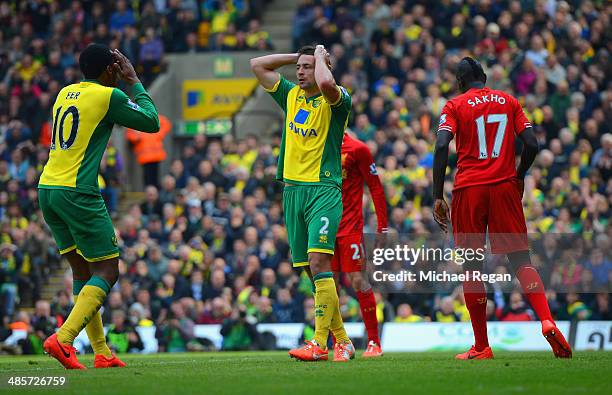 Russell Martin and Leroy Fer of Norwich City react after a missed chance on goal during the Barclays Premier League match between Norwich City and...