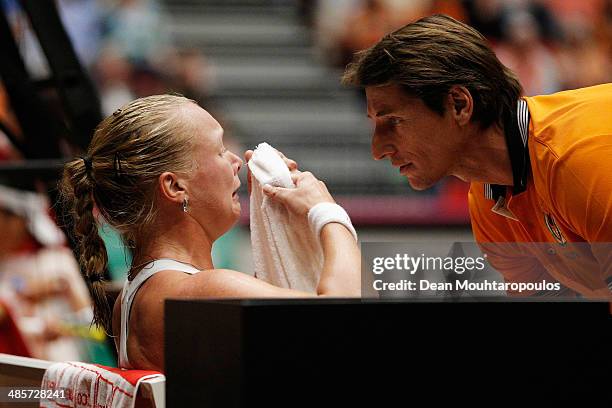 Kiki Bertens of Netherlands cries between sets in the match against Kurumi Nara of Japan with Captain, Paul Haarhuis during the Fed Cup World Group...