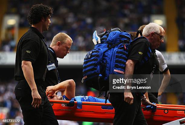 Tom Cleverley of Everton is taken off the pitch by stretchers after picking up injury during the Barclays Premier League match between Tottenham...