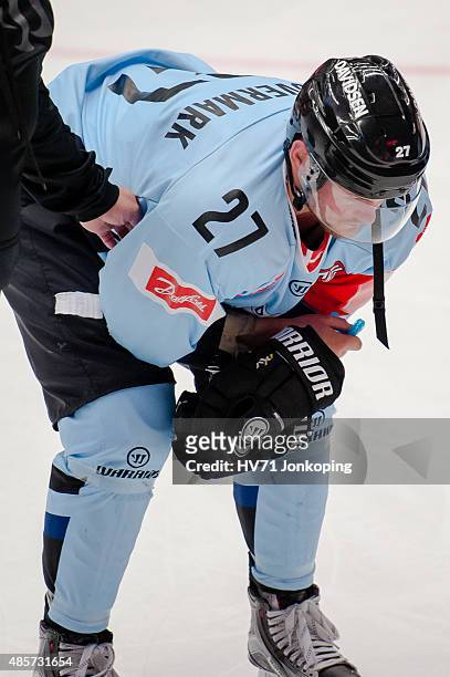 Anders Overmark of Sonderjyske injury puck in face during the Champions Hockey League group stage game between HV71 Jonkoping and SonderjyskE Vojens...