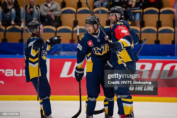 Mattias Tedenby of HV71, Teemu Laine of HV71and Ryan O´Byrne of HV71 celebrate a goal during the Champions Hockey League group stage game between...