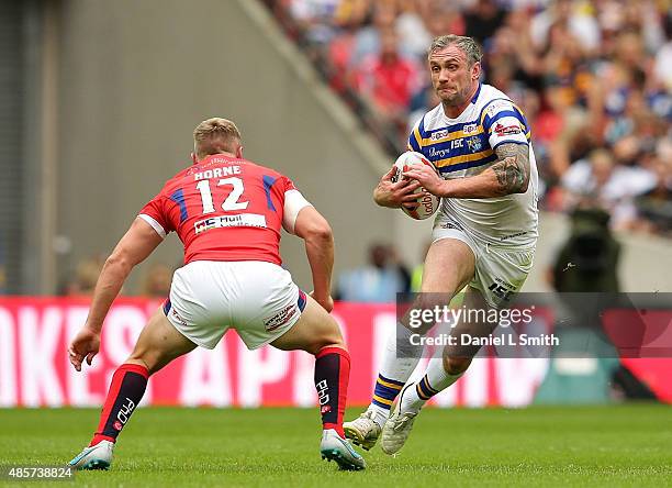 Jamie Peacock of Leeds Rhinos manevours around Graeme Horne of Hull KR during the Ladbrokes Challenge Cup Final between Leeds Rhinos and Hull KR at...