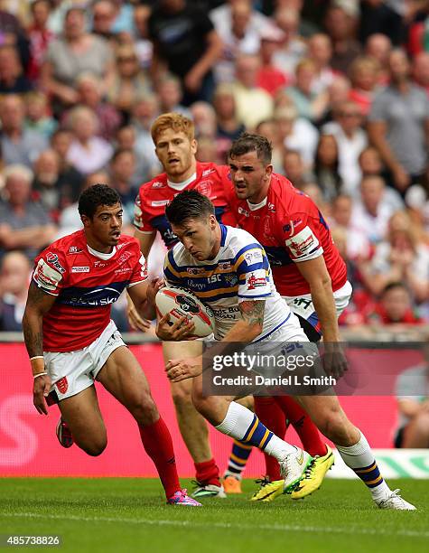 Tom Briscoe of Leeds Rhinos pushes through Hull KR during the Ladbrokes Challenge Cup Final between Leeds Rhinos and Hull KR at Wembley Stadium on...