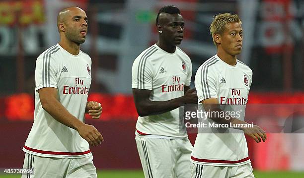 Keisuke Honda, Mario Balotelli and Alex Dias da Costa of AC Milan look on before the Serie A match between AC Milan and Empoli FC at Stadio Giuseppe...