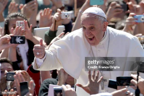 Pope Francis greets the faithful as he holds Easter Mass in St. Peter's Square on April 20, 2014 in Vatican City, Vatican. Pope Francis is attending...