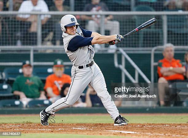 April 19: Kyle Richardson of the Notre Dame Fighting Irish hits the ball against the Miami Hurricanes on April 19, 2014 at Alex Rodriguez Park at...