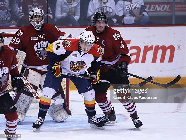 Brendan Gaunce of the Erie Otters skates against Matt Finn of the Guelph Storm in Game Two of the OHL Western Conference Final at the Sleeman Centre...